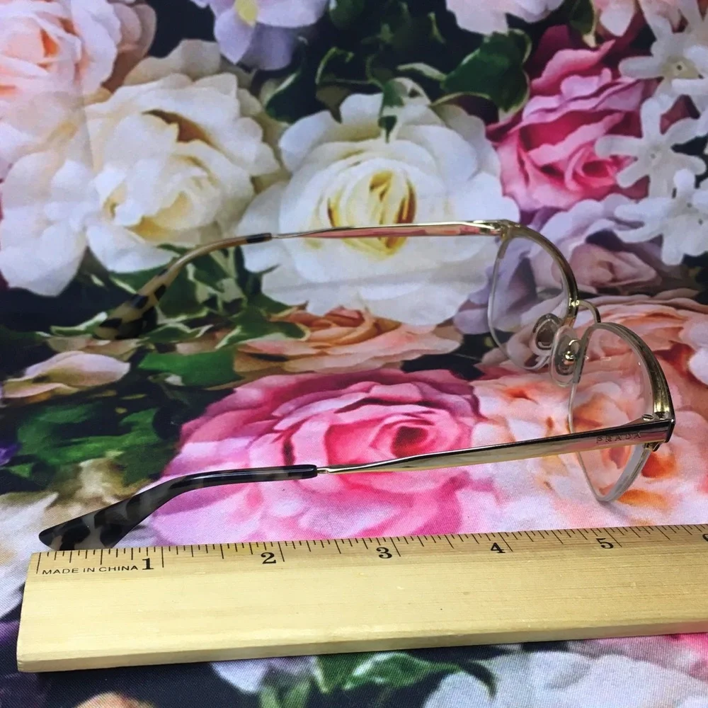 Prada Black top rim & Gold metal bottom rim and arms Good stored condition